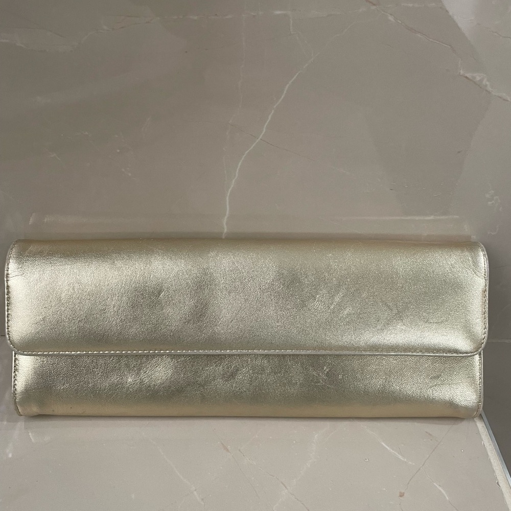 Stuart Weitzman gold clutch with strap